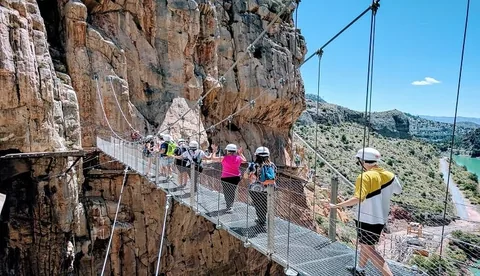 Visitors walking the cliffside route at Caminito del Rey