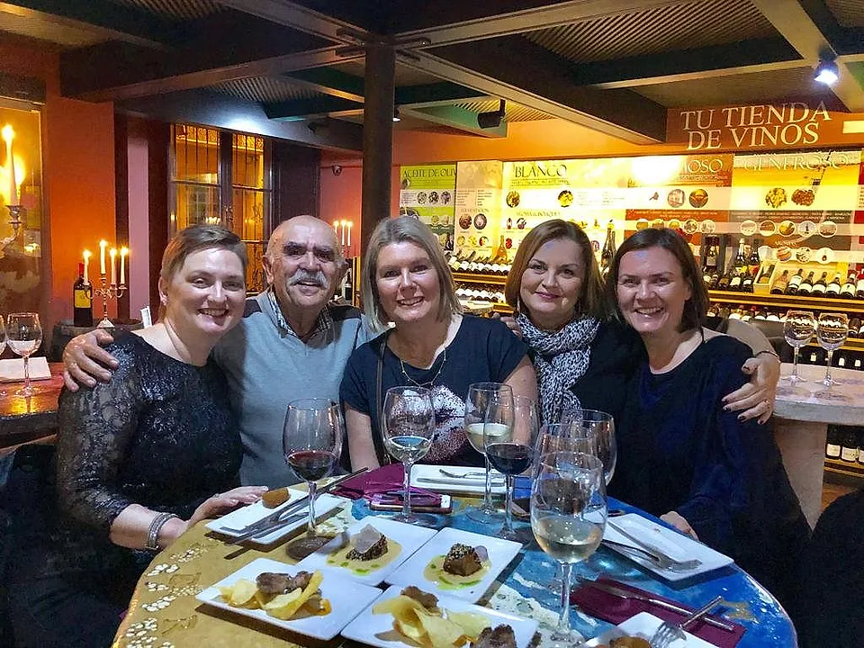 Guests sharing tapas and Málaga wines during a private hosted food experience.