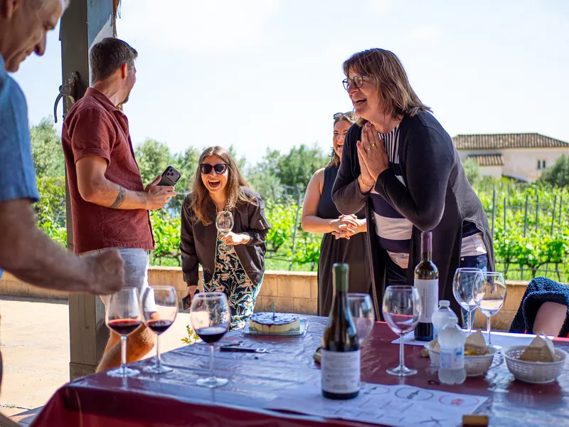 Private celebration group enjoying wine in a vineyard setting near Malaga.