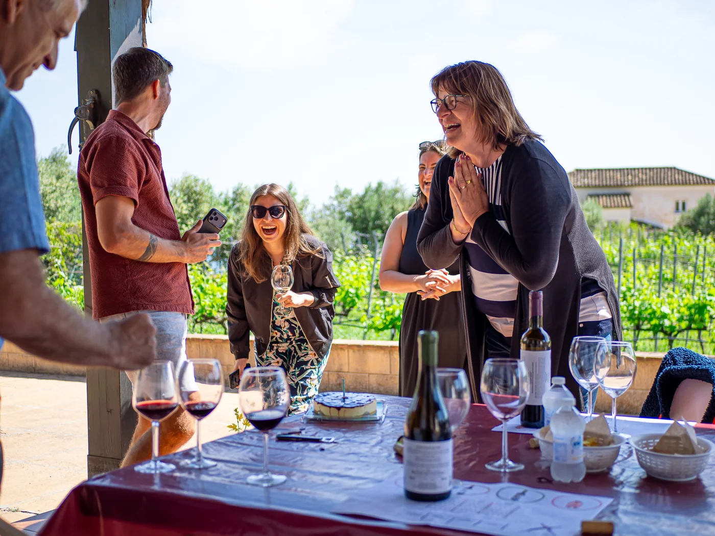 Birthday-style private moment around a tasting table.