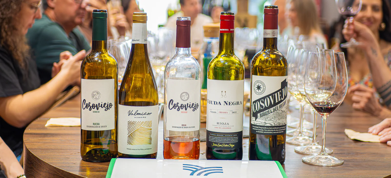 Five Spanish wines lined up on the city tasting table.