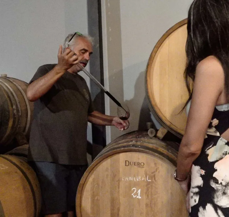 Antonio Mérida drawing an experimental wine directly from a barrel