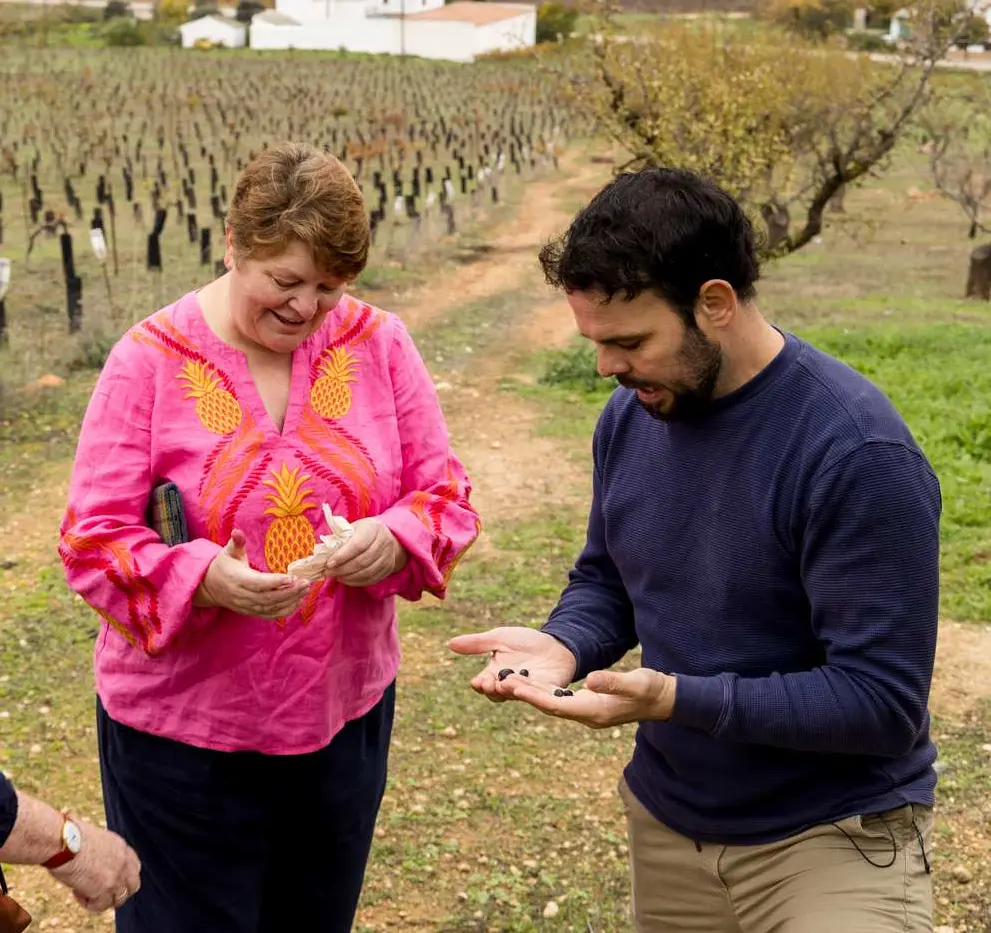 Guests examining plants during the guided walk through the organic countryside.