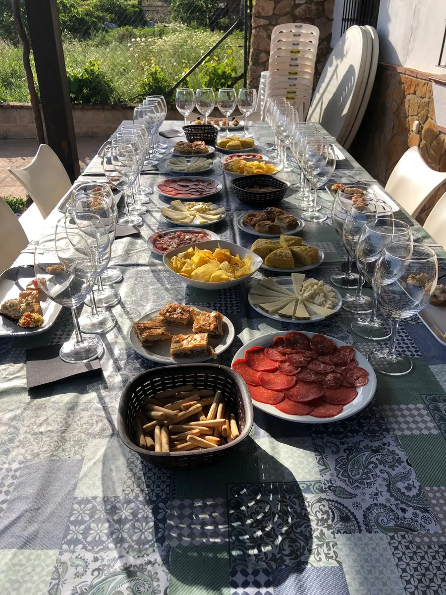 Tapas, olive oil and wine glasses set out for the vineyard tasting.