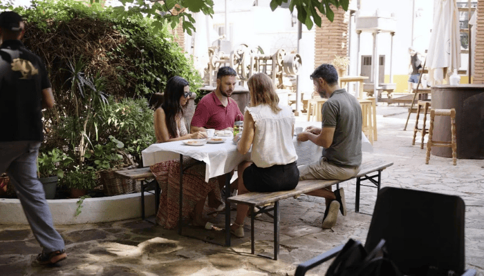 Team enjoying an olive oil tasting experience during a business tour in Malaga