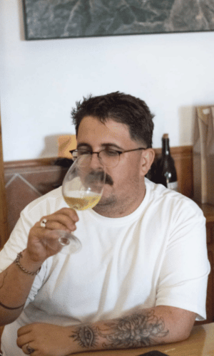 Man tasting natural white wine during a wine tasting in Málaga